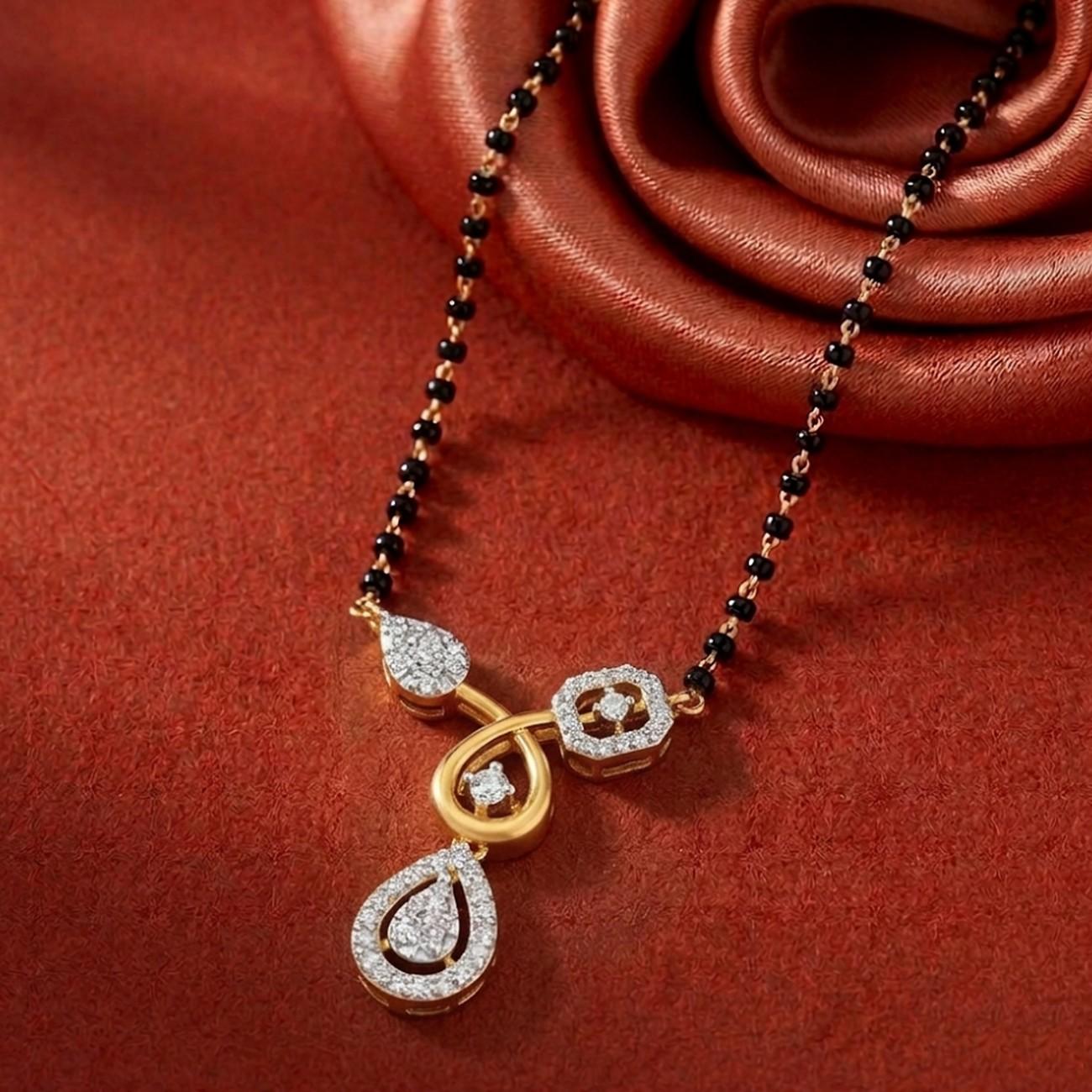 Yellow gold & diamond floral mangalsutra on red background