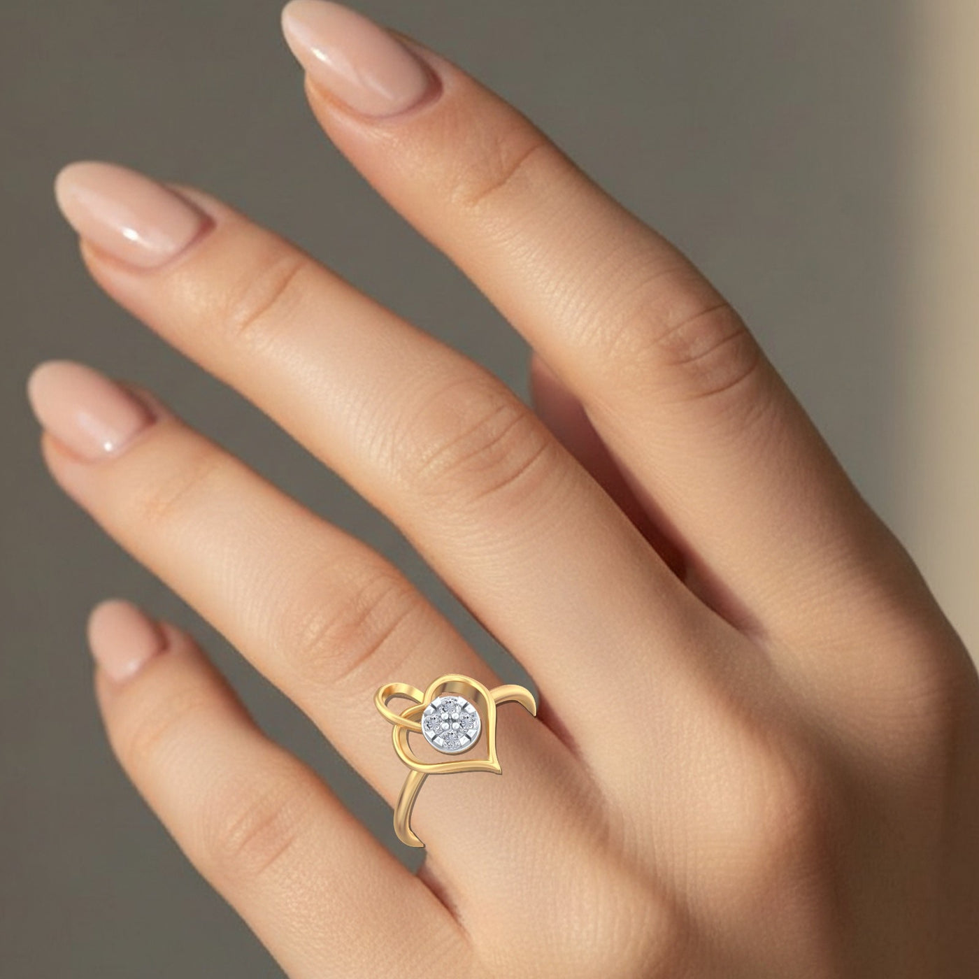 Gold ring with a diamond on a hand against a neutral background

