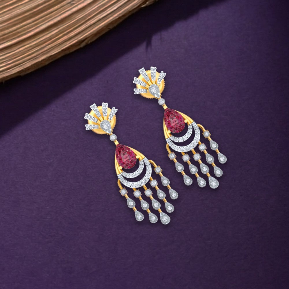 Gold and diamond earrings with a chandelier design, featuring ruby stones at the top on a purple background.