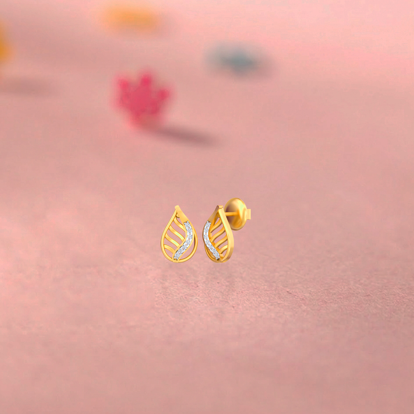 Gold & Diamond Teardrop-Shaped Stud Women Earring on a pink backgound.