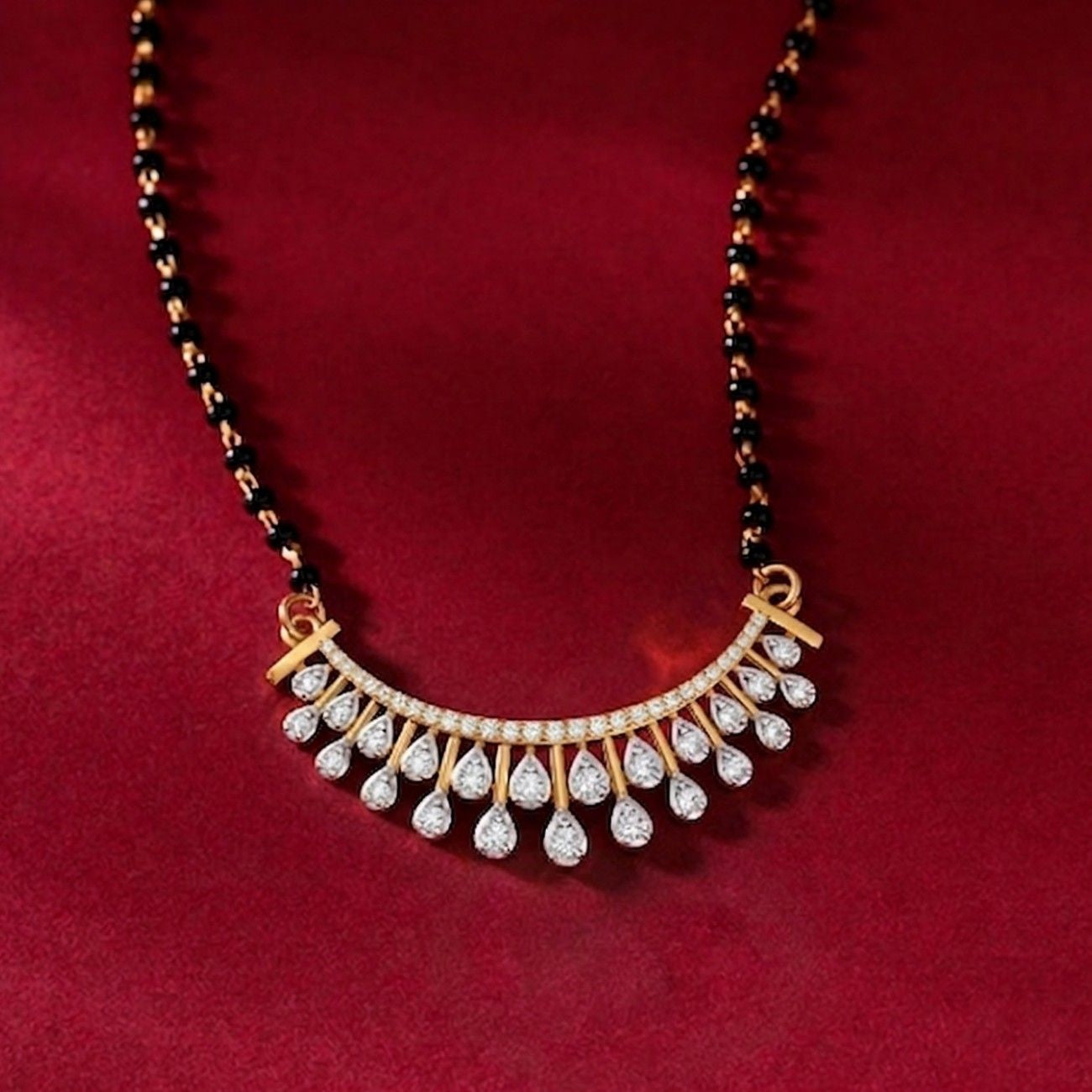 gold & diamond curved mangalsutra on red background