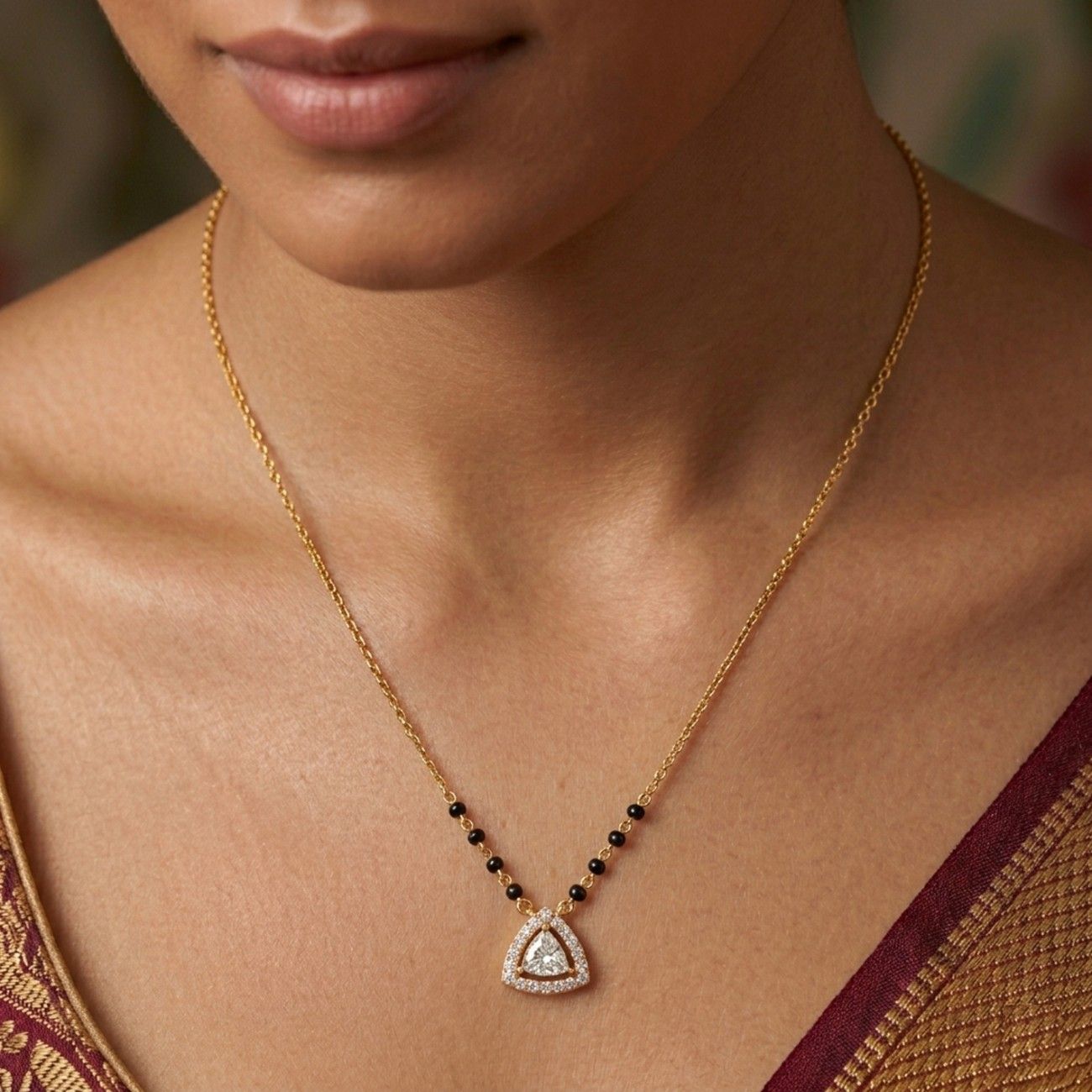 Women wearing gold & diamond modern beaded mangalsutra