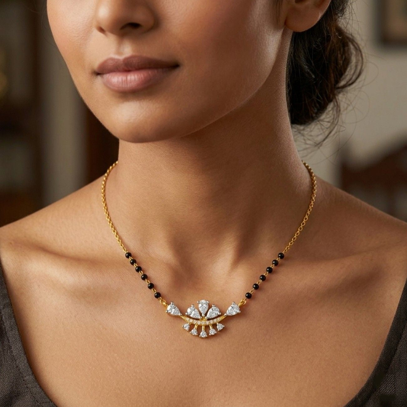 Women wearing gold & diamond floral mangalsutra