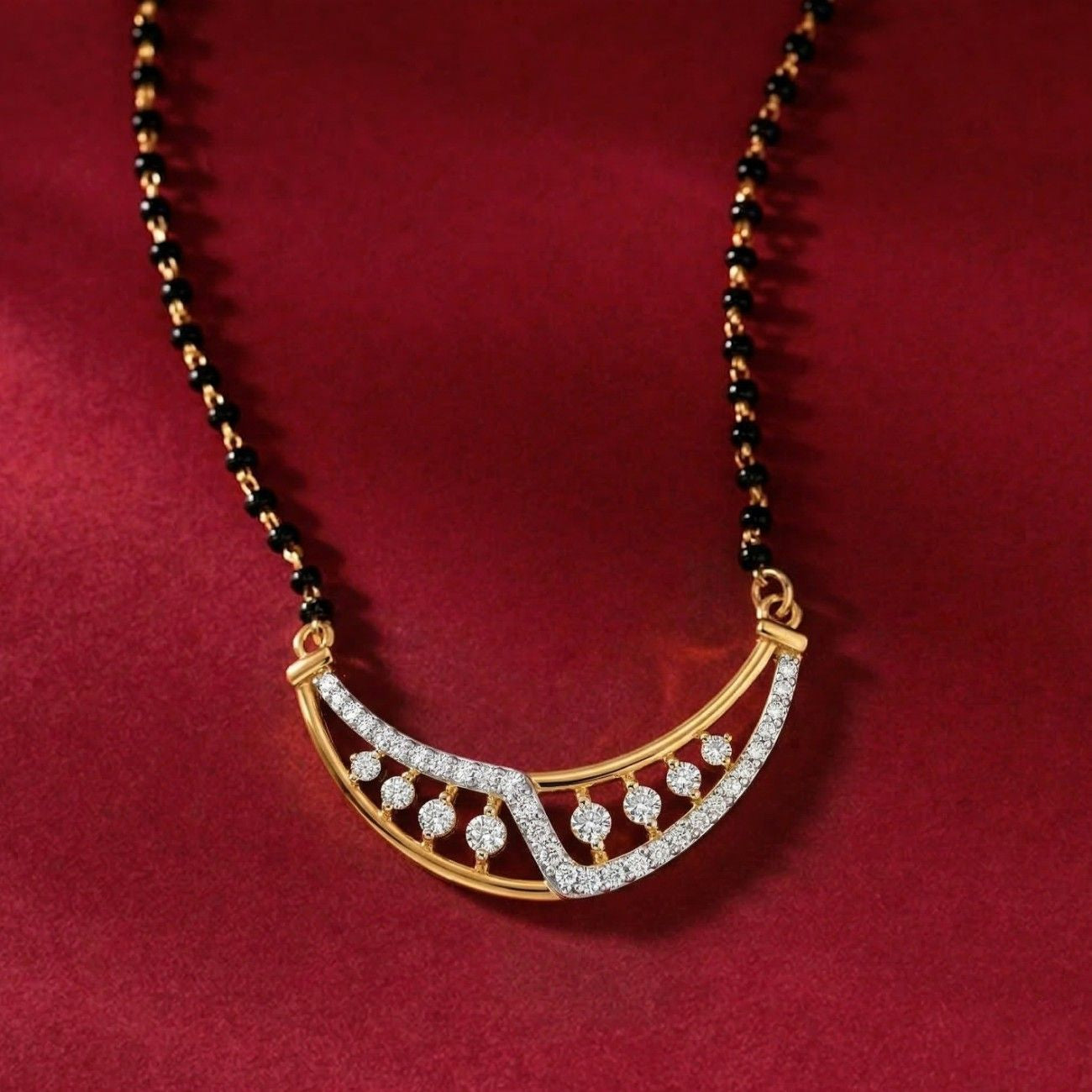 Yellow gold & diamond modern mangalsutra on red background