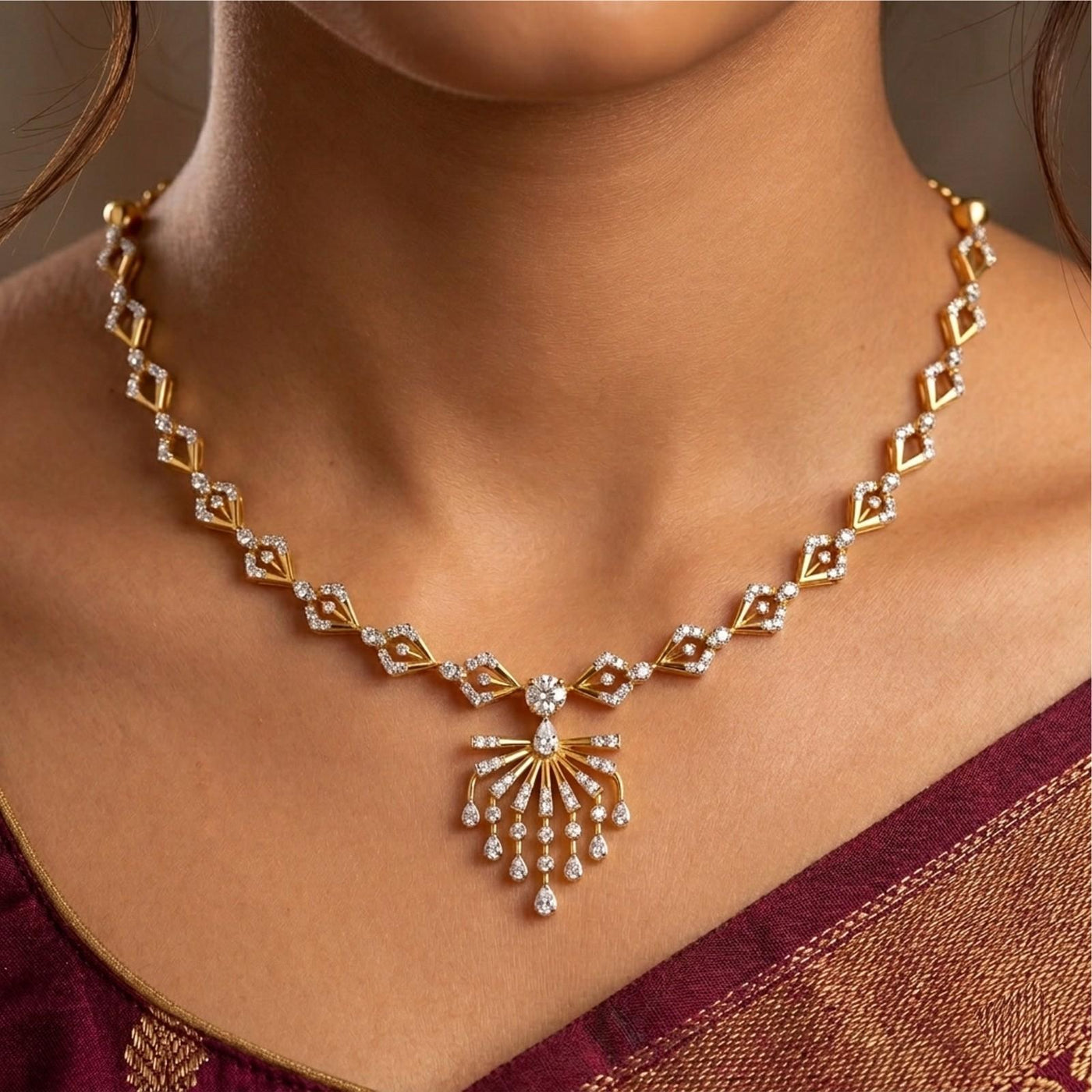 Gold and diamond necklace worn on a model's neck, featuring a detailed with teardrop-shaped diamonds.