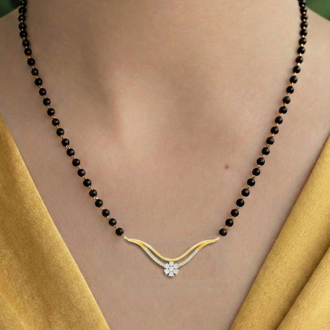 Women Wearing Gold & Diamond Elegant Modern Mangalsutra 