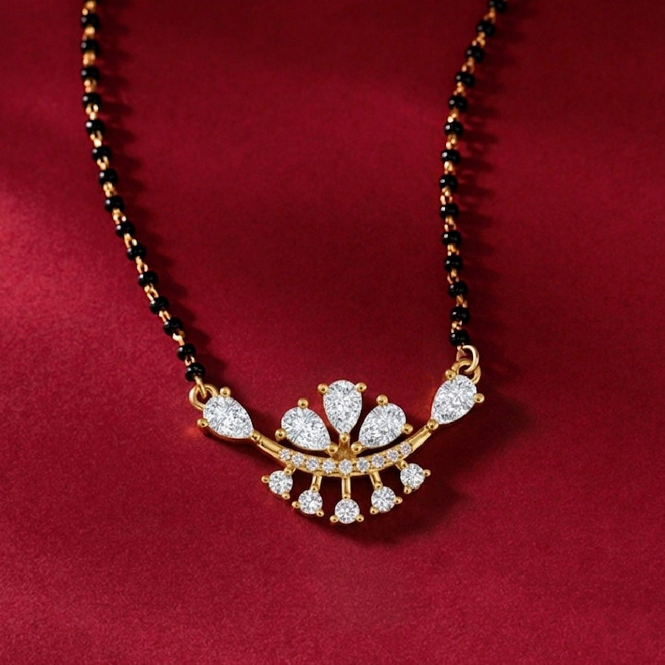 gold & diamond floral mangalsutra on red background