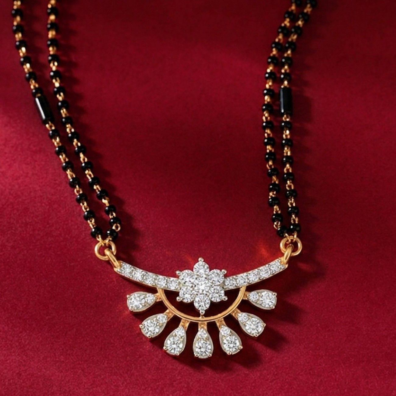 Yellow gold & diamond designer floral mangalsutra on red background