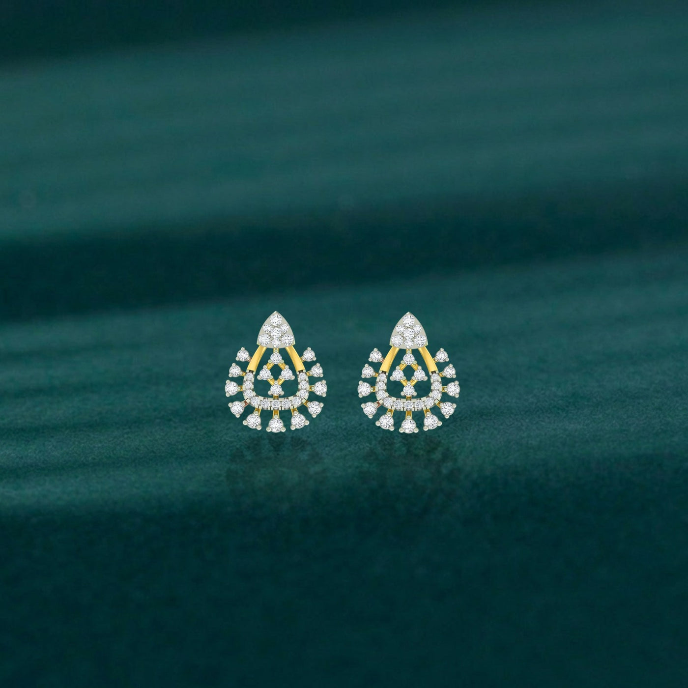 Gold and diamond stud earring with floral-shaped on a teal background.