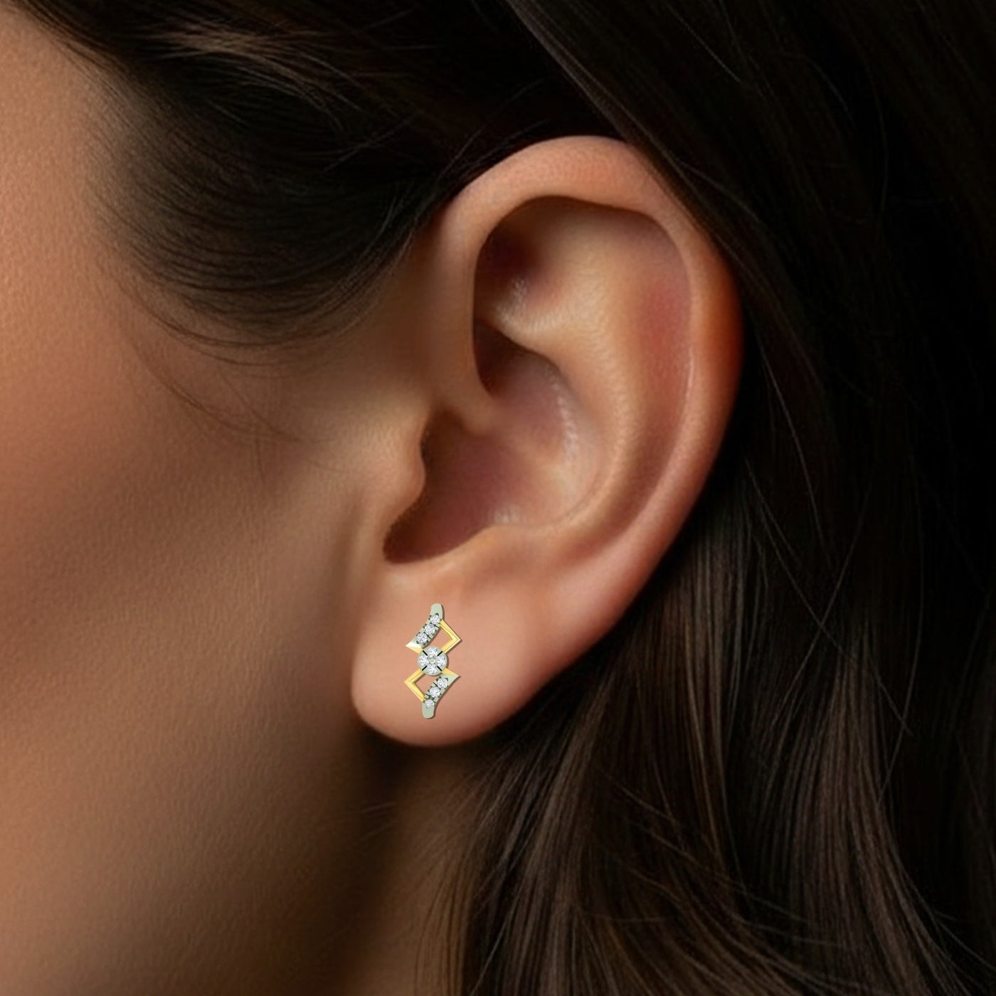 Close-up shot gold and diamond dailywear stud earring.
