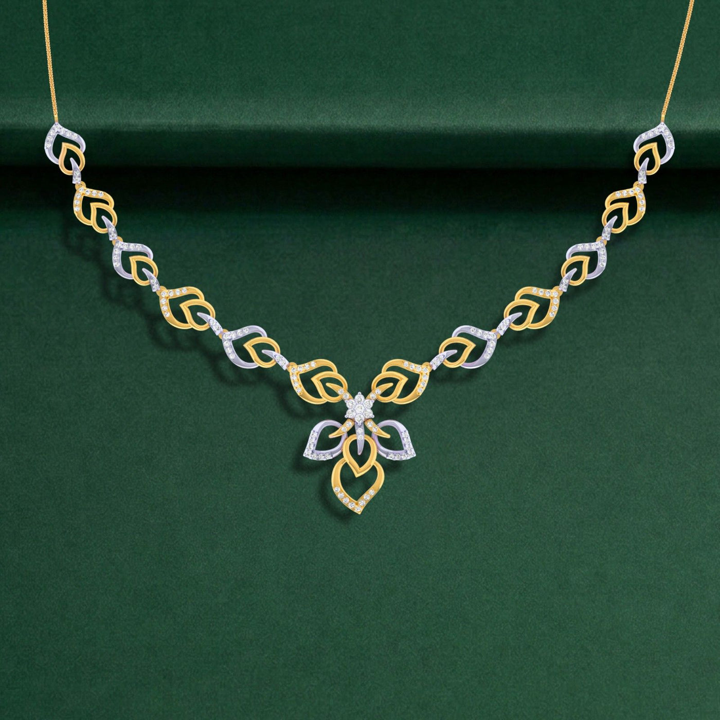 Gold and diamond necklace on a green background