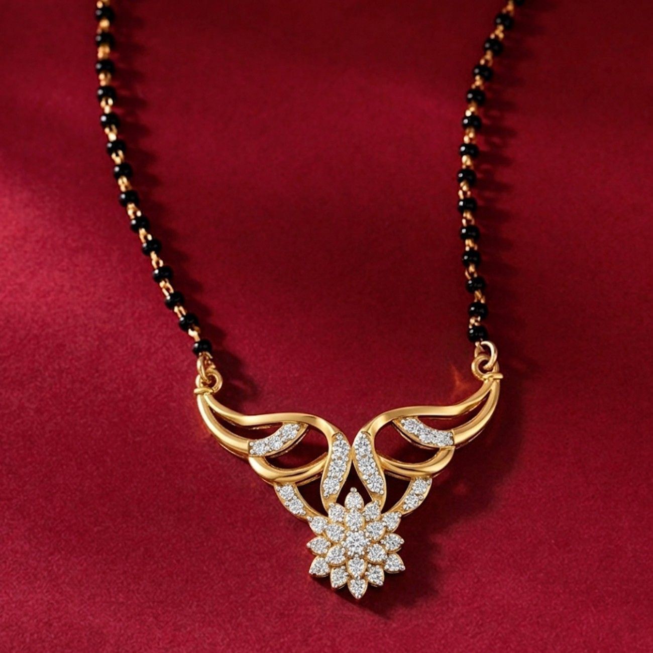 Yellow gold & diamond floral mangalsutra on red background