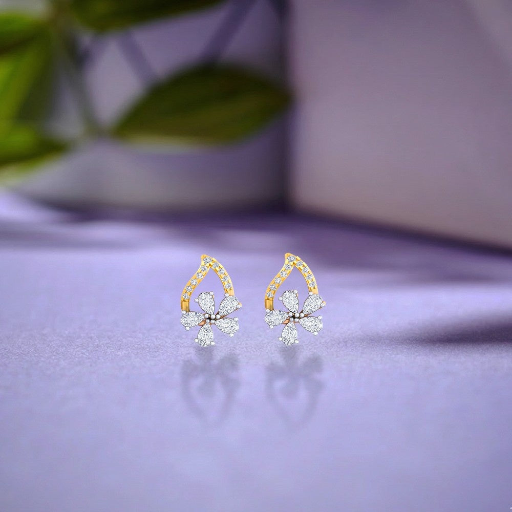 Gold & diamond floral women stud earrings in gold with sparkling natural diamonds on a white background.