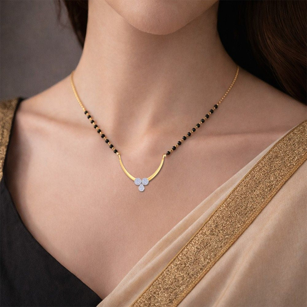 Women wearing yellow gold & diamond modern floral mangalsutra
