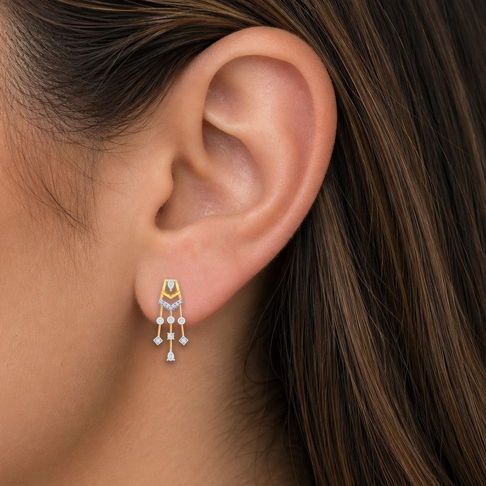 Gold and diamond earrings with intricate designs, close-up shot.