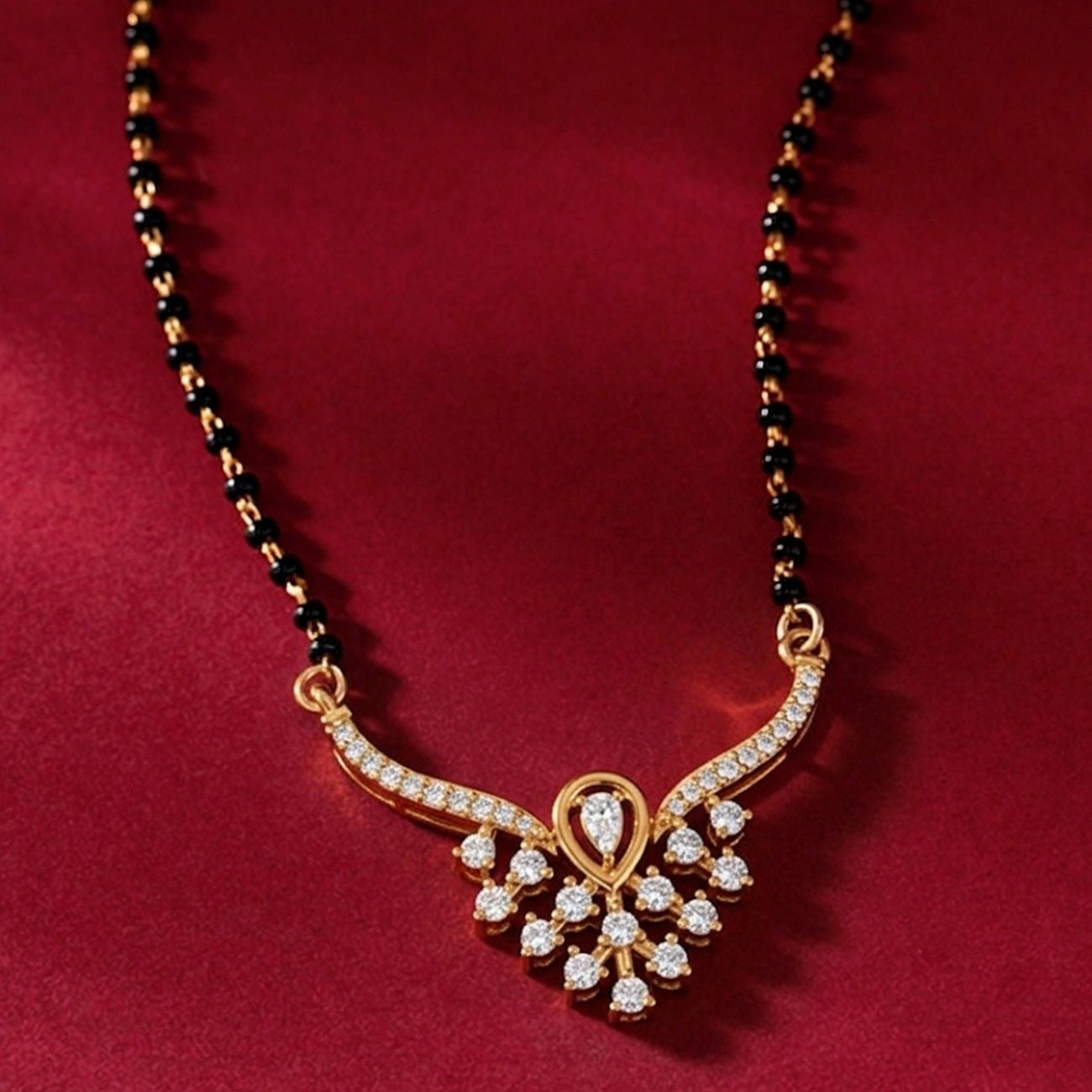 gold & diamond bridal mangalsutra on red background