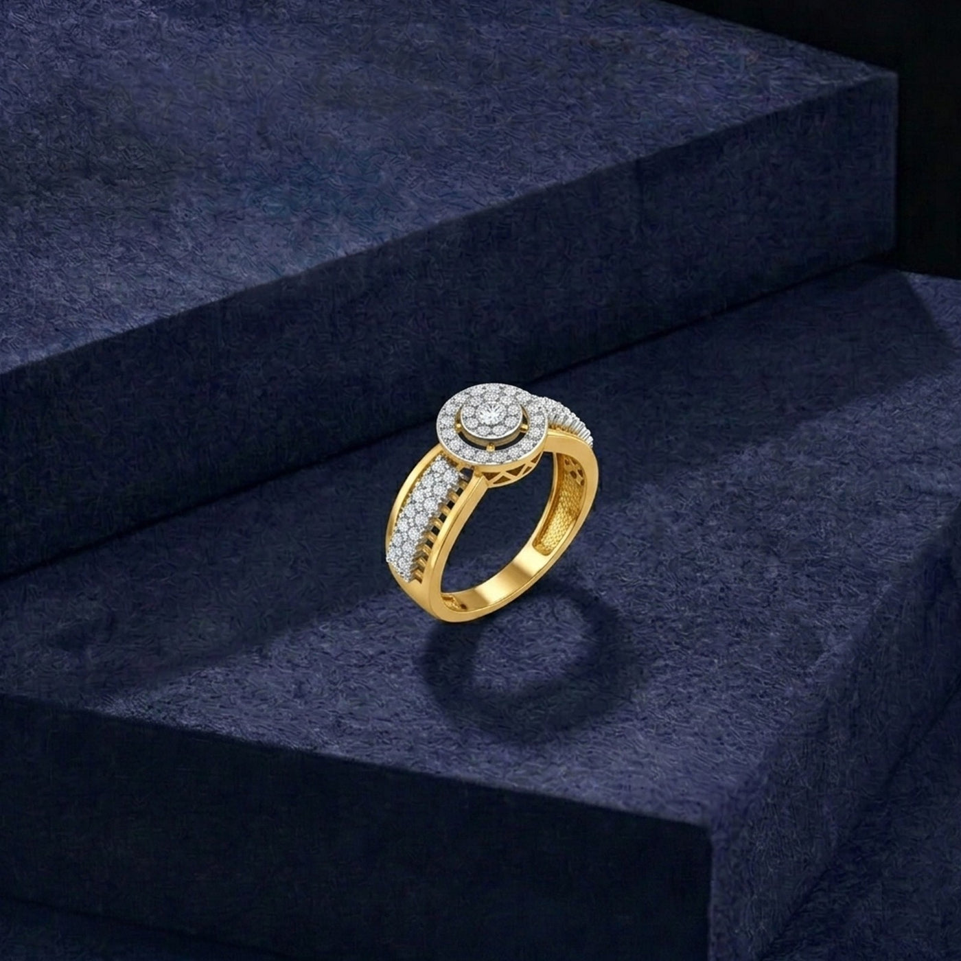 Gold ring with diamonds on a dark blue textured surface