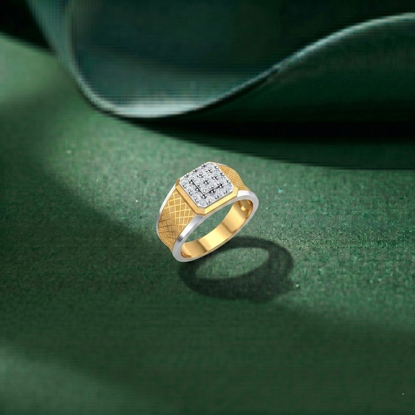 Gold ring with a diamond-studded band on a green surface