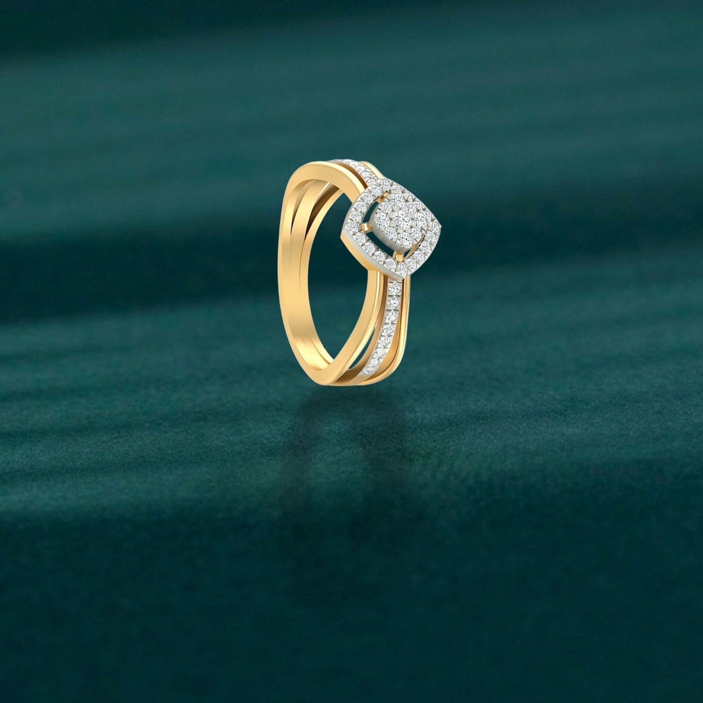 Gold ring with diamond accents on a green textured background