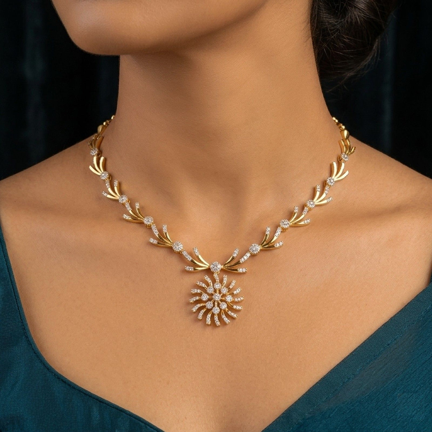 Gold necklace with a sunflower design on a model against a dark background.