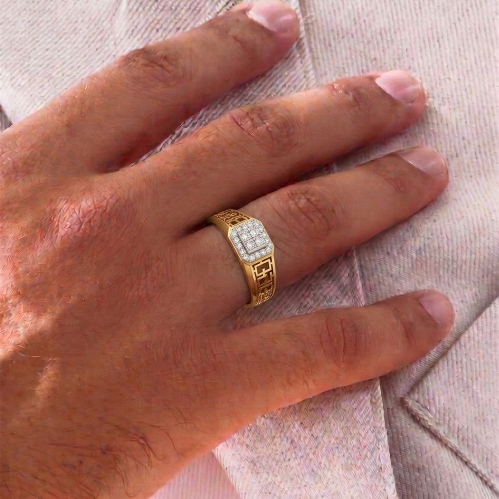 A gold ring with a square diamond-encrusted worn on a person's finger.
