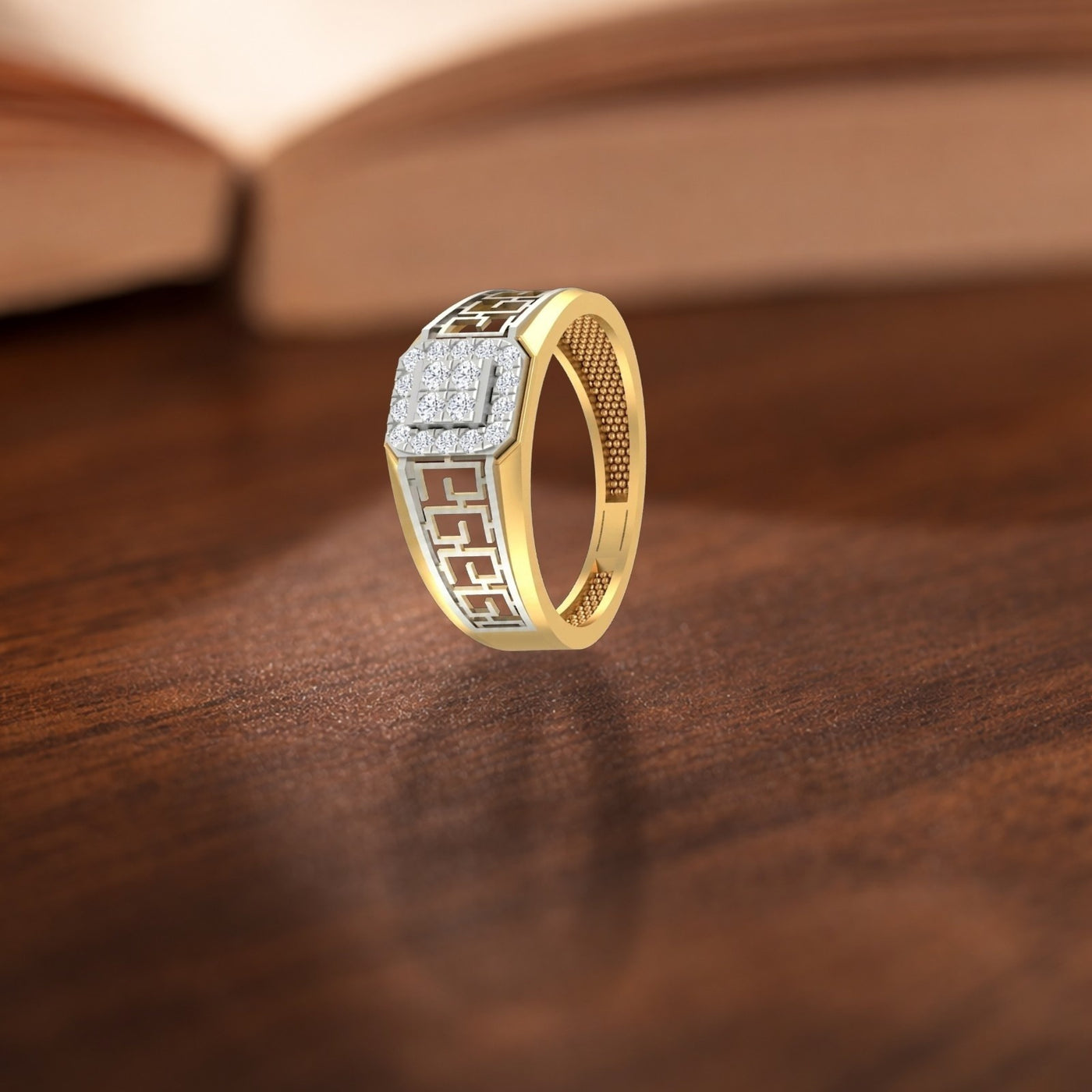 Gold ring with diamond accents on a wooden surface.