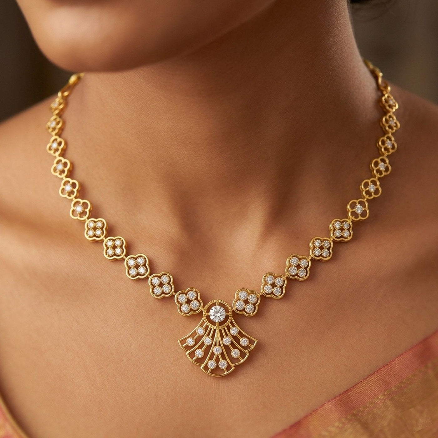 Gold and diamond necklace with floral motifs, worn on a model's neck.