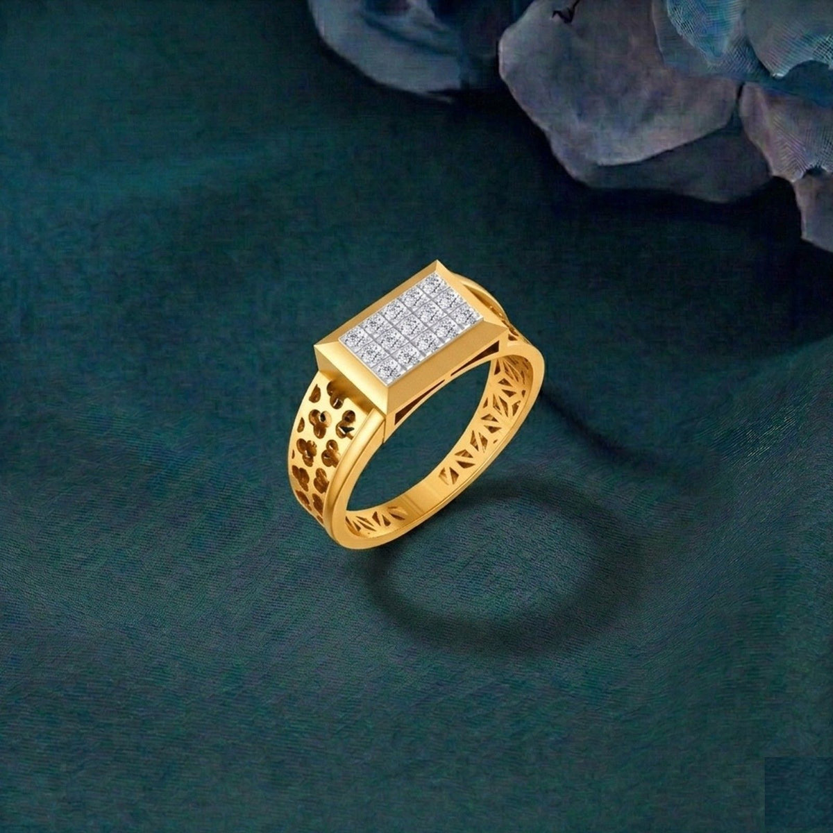 Gold ring with diamond accents on a dark green background.