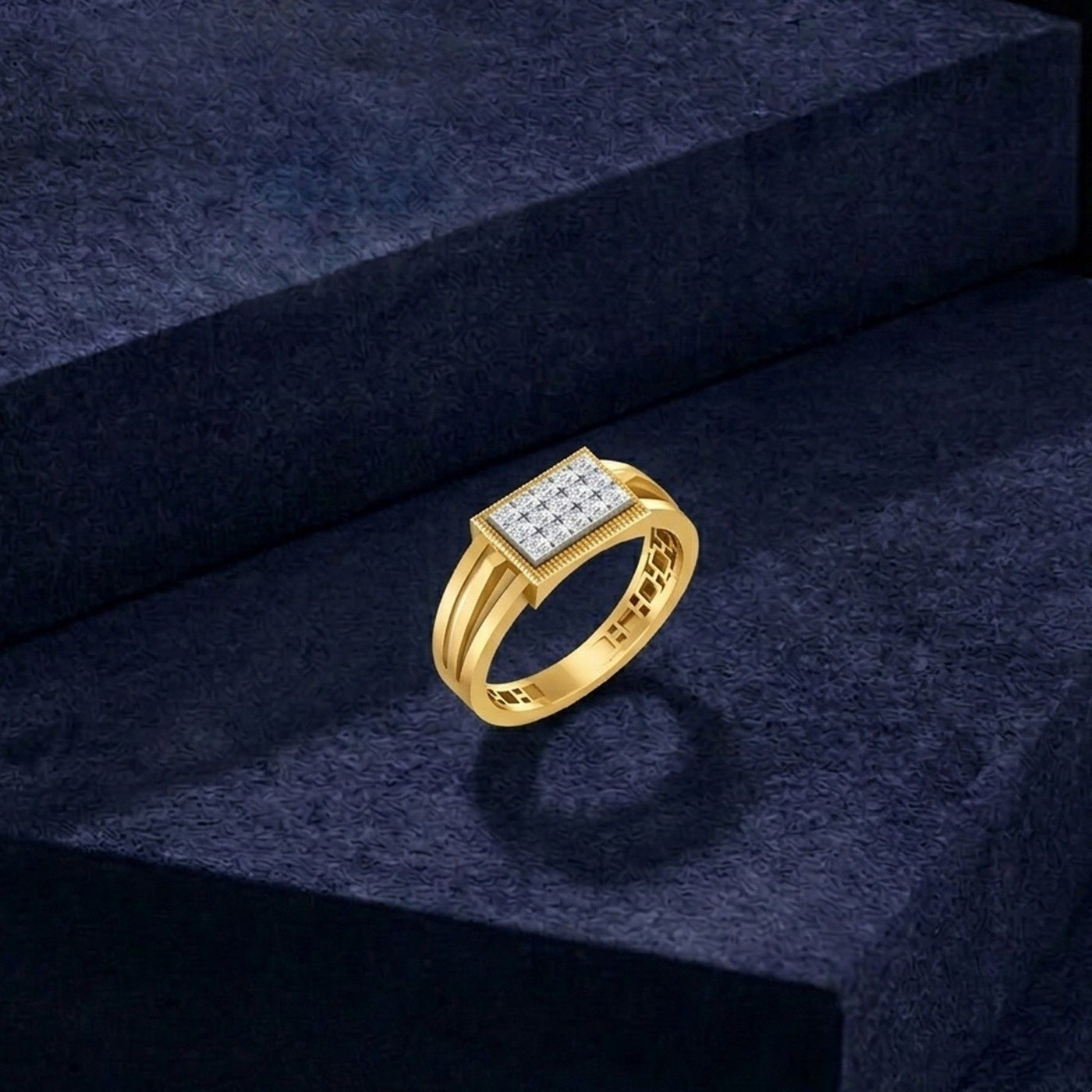 Gold ring with diamonds on a dark blue textured surface