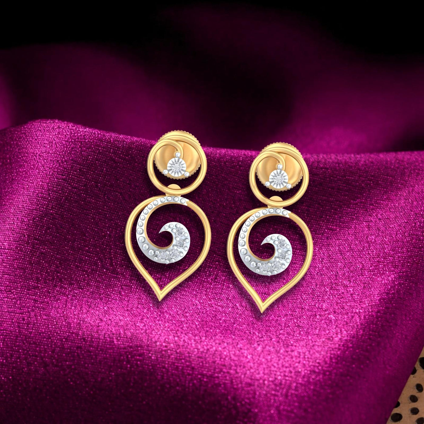 Gold and diamond earrings with spiral design on a magenta fabric background