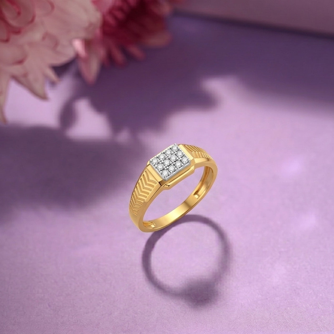 Gold ring with diamond accents on a purple surface