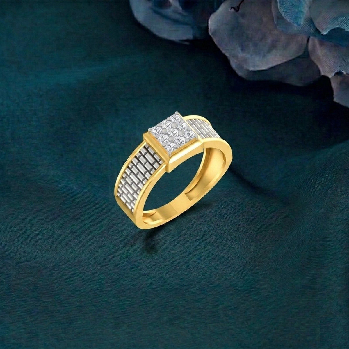 Gold ring with diamond accents on a dark green textured background