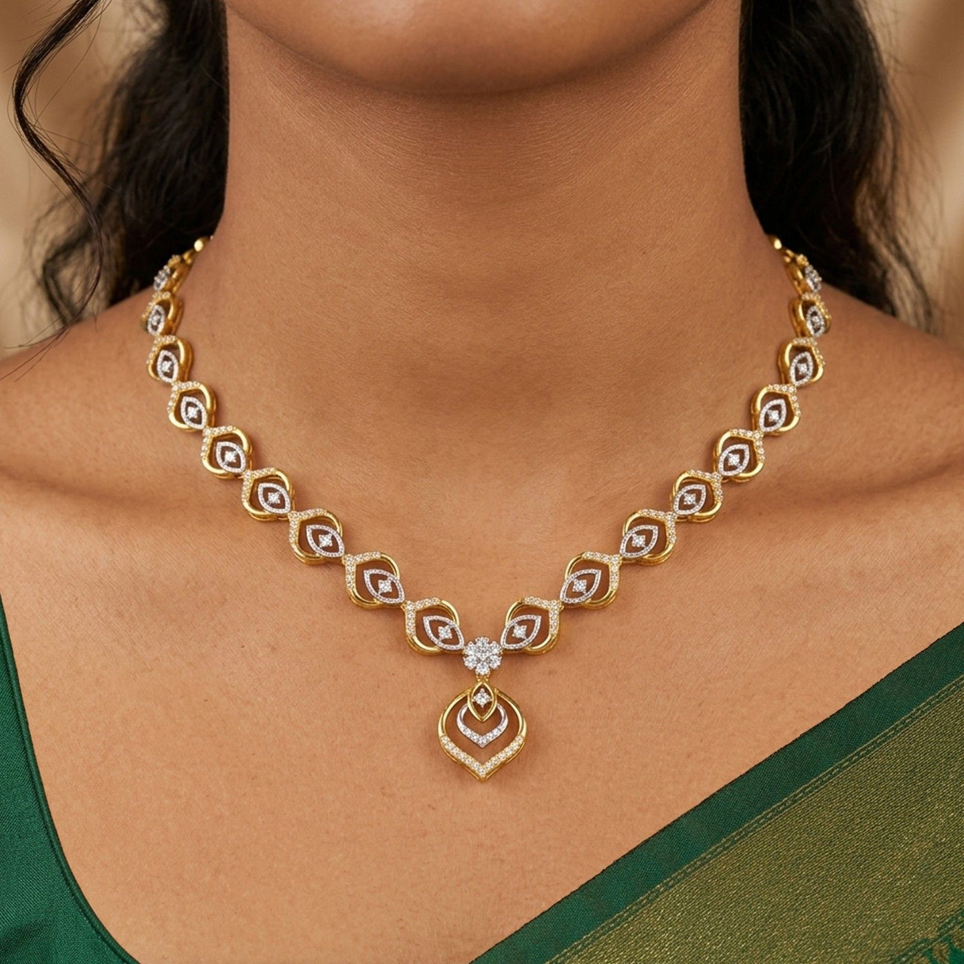 Gold necklace with diamond-like stones worn by a person