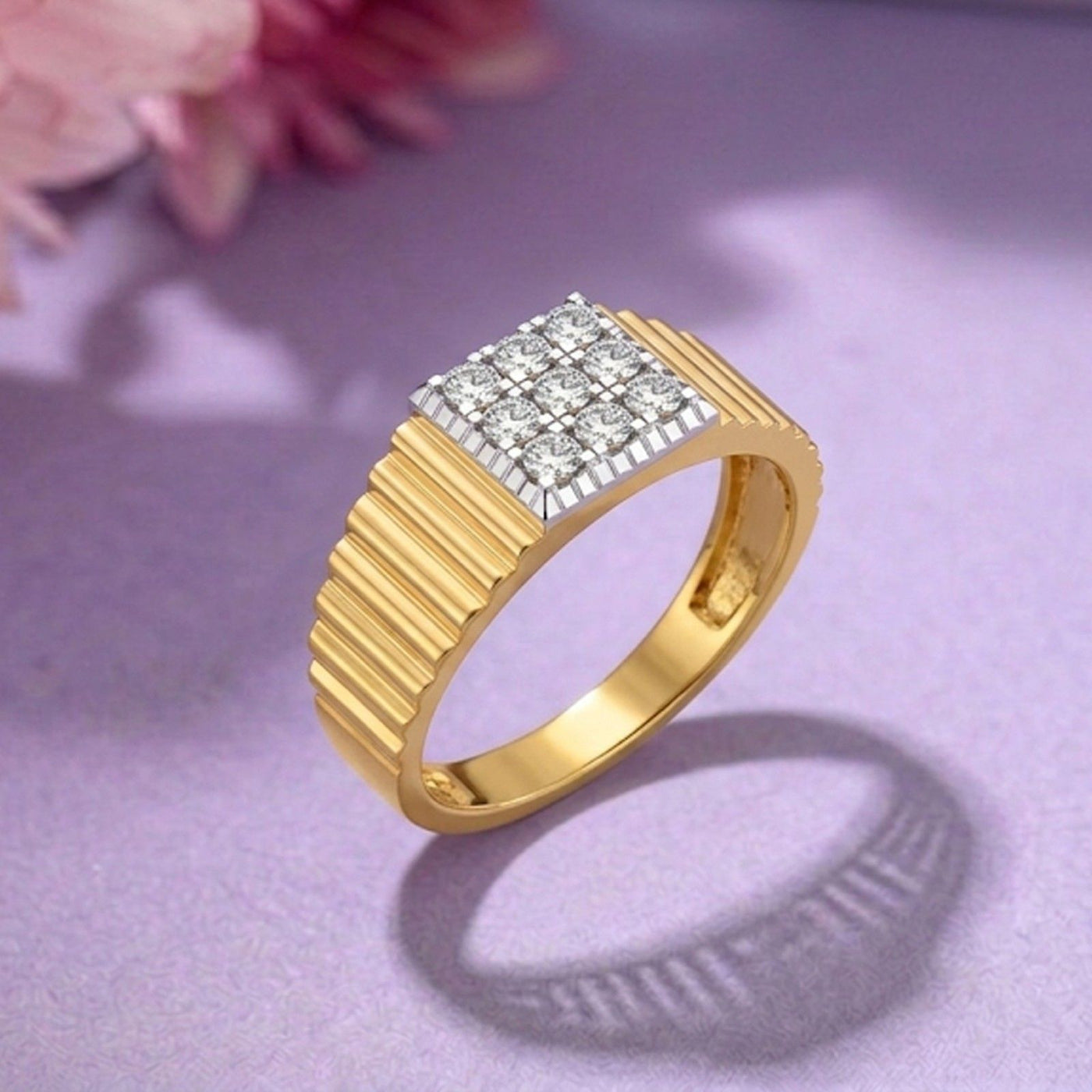 Gold ring with diamond-studded band on a purple background