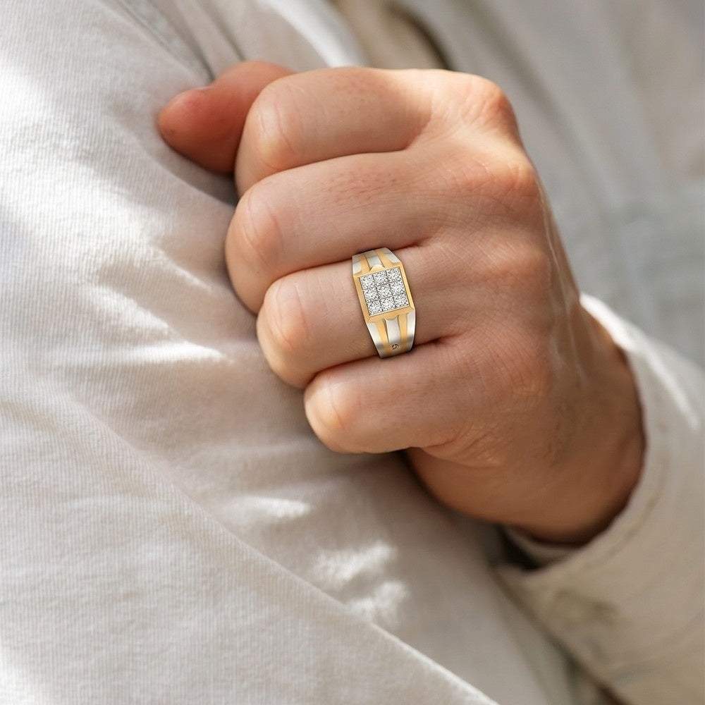 Hand wearing a gold ring with diamonds on a light fabric background.