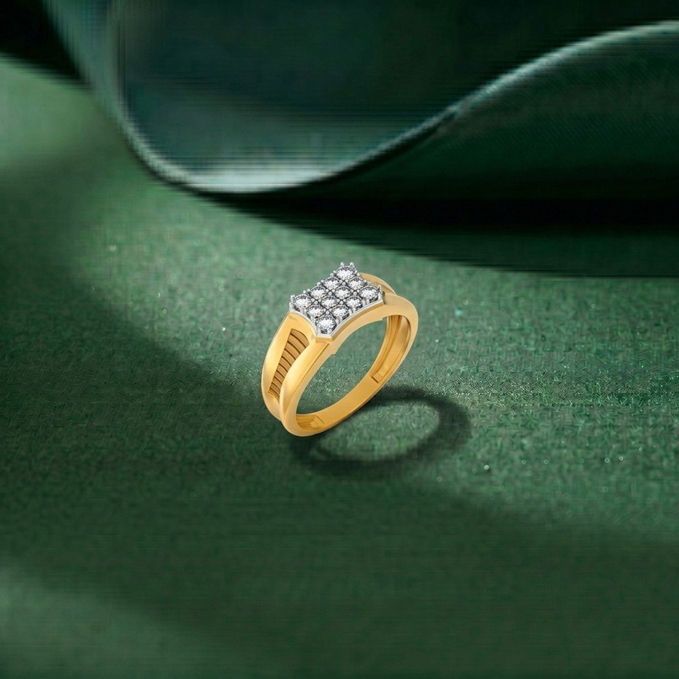 Gold ring with diamonds on a green textured surface