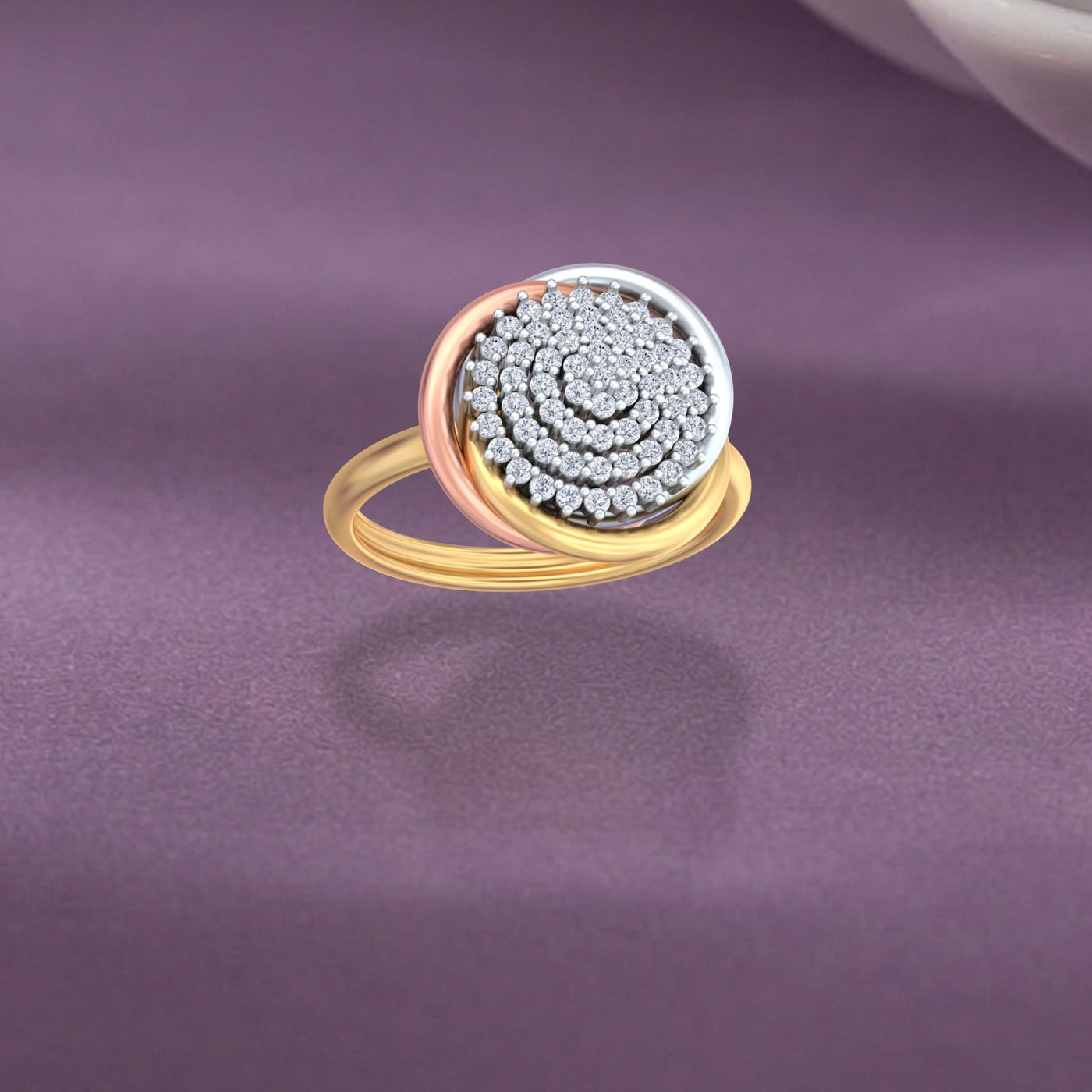 Gold and diamond ring with intricate design on a purple fabric background