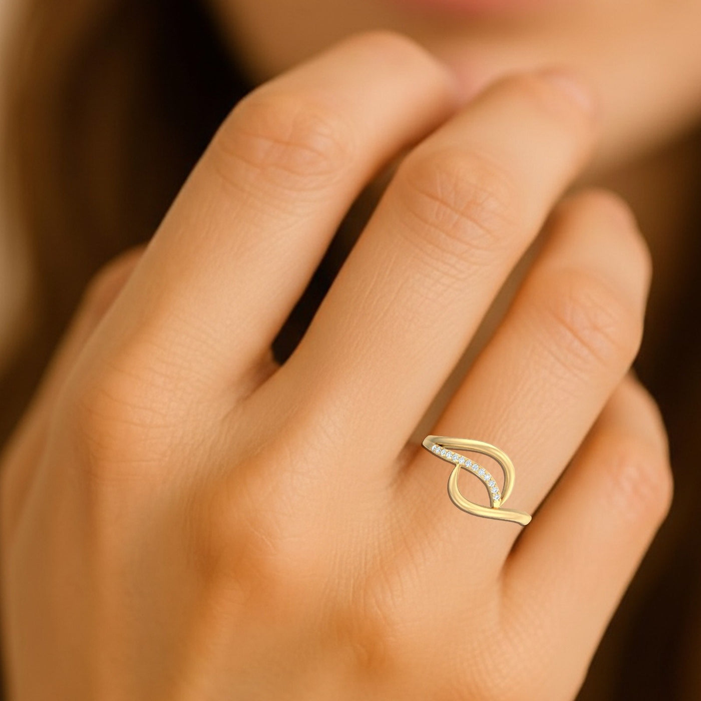 Close-up shot of a gold ring with diamond accents ring.