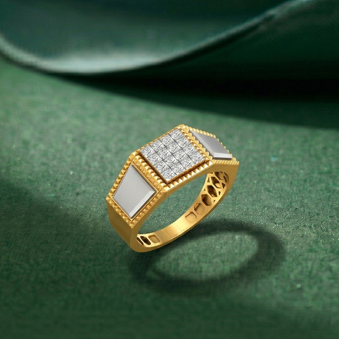 Gold ring with diamond accents on a green textured surface