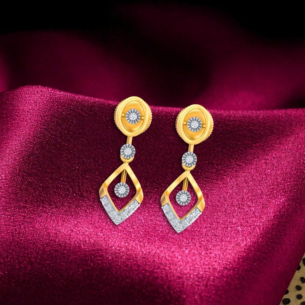Gold & diamond geometric women dangler earrings with an open-frame diamond design on red fabric background.