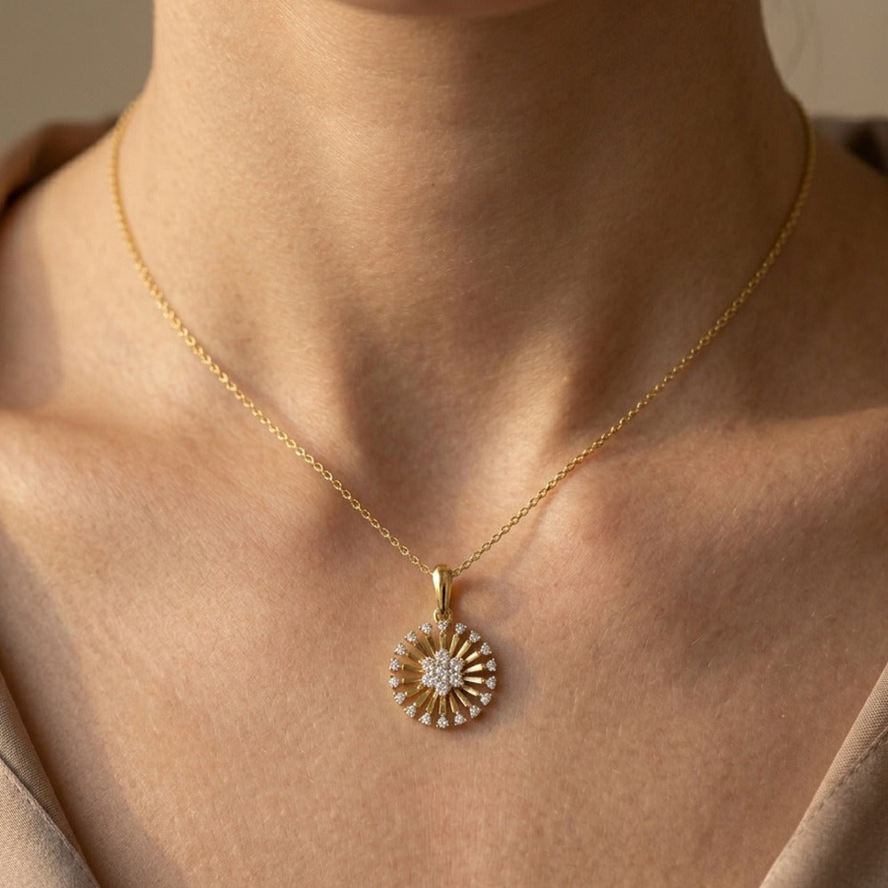 Women wearing gold and diamond pendant 
