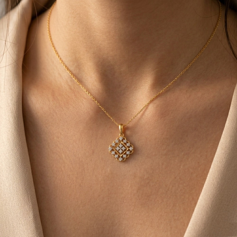 Women wearing gold and diamond floral pendant