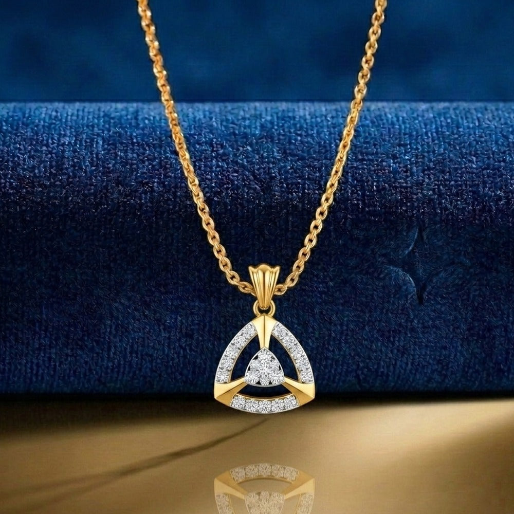 gold and diamond partywear pendant on blue fabric background