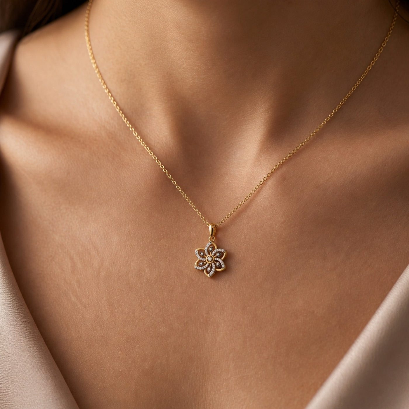 Women wearing gold and diamond floral pendant