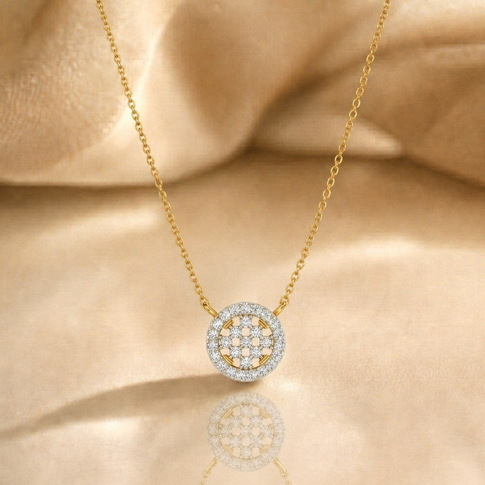 Gold pendant with a circular pendant on a beige fabric background
