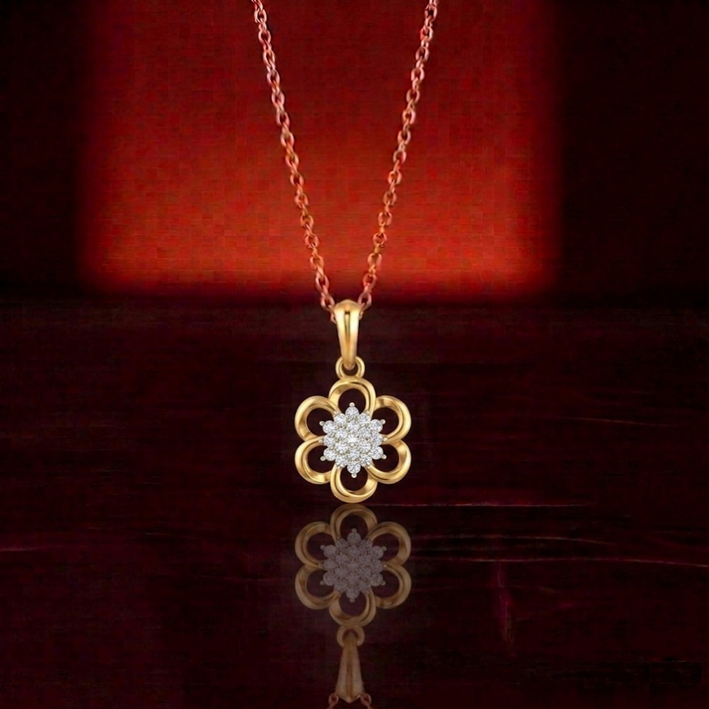 Gold flower-shaped pendant with diamonds on a dark background