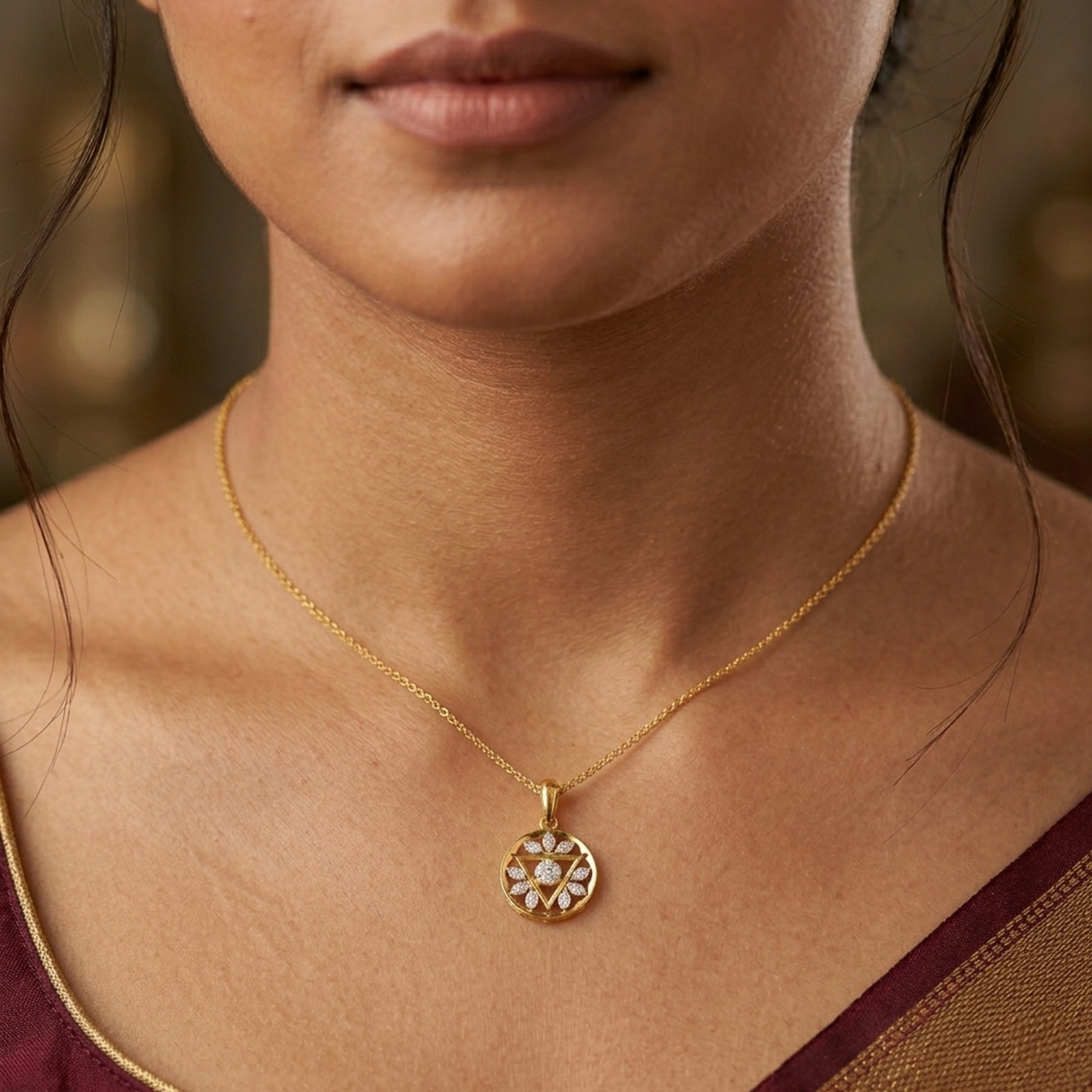 Gold and diamond pendant on a womens neck