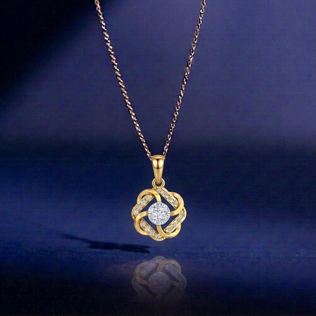Gold pendant necklace with a diamond on a dark blue background