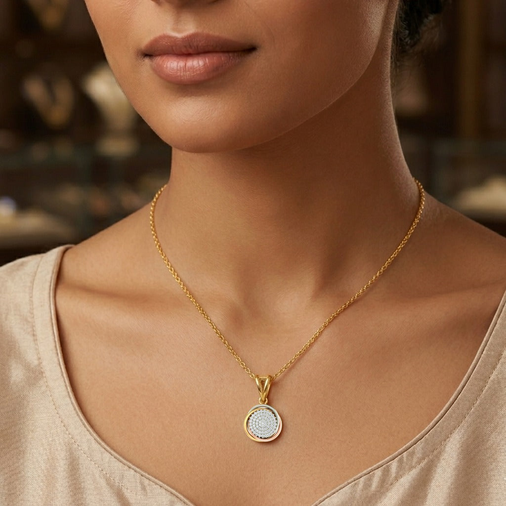 Gold necklace with a pendant worn by a person, blurred background
