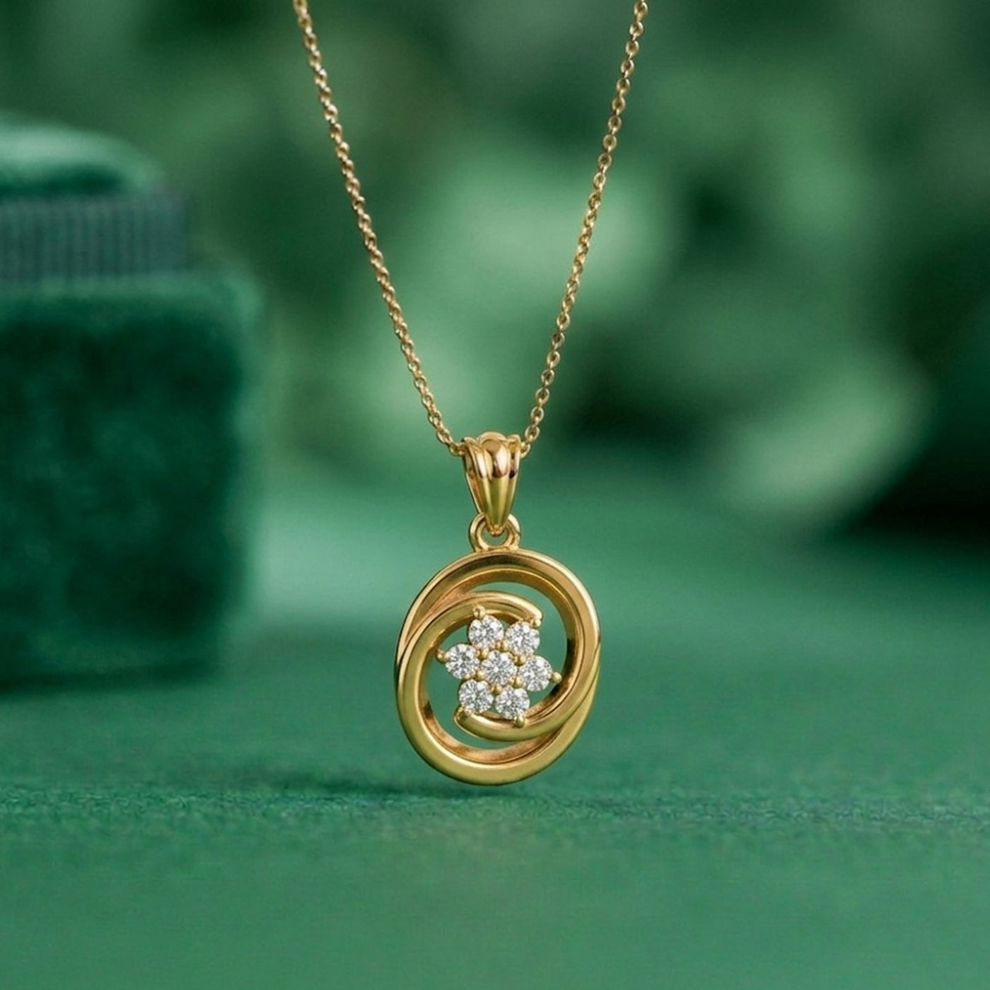 Gold pendant necklace with a green background